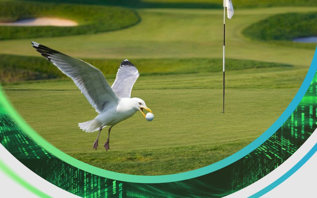 A seagull carrying a golf ball across a putting green